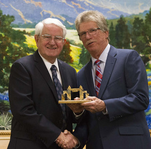 Dr. John Read receives his award as a Hall of Fame Inductee from Jimmy Aiken, alumni special projects manager.